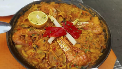 Arroz con marisco + Entrantes + Postre para dos personas